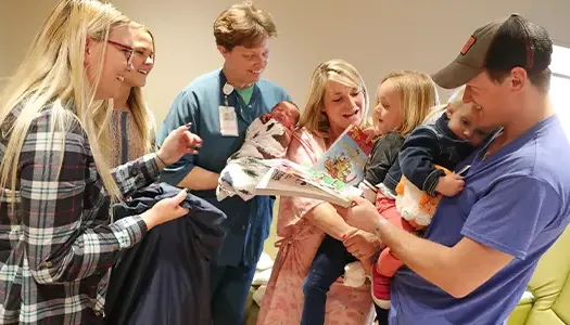 family welcoming new baby