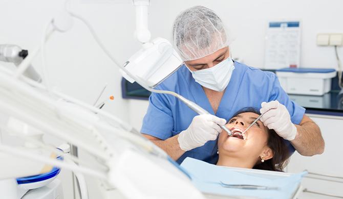 Dentist performing procedure